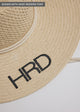 Close up of black embroidery on surfer style sun hat