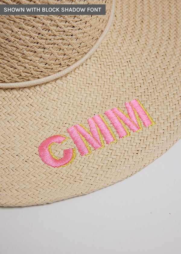 Close up of surfer style sun hat with embroidered letters