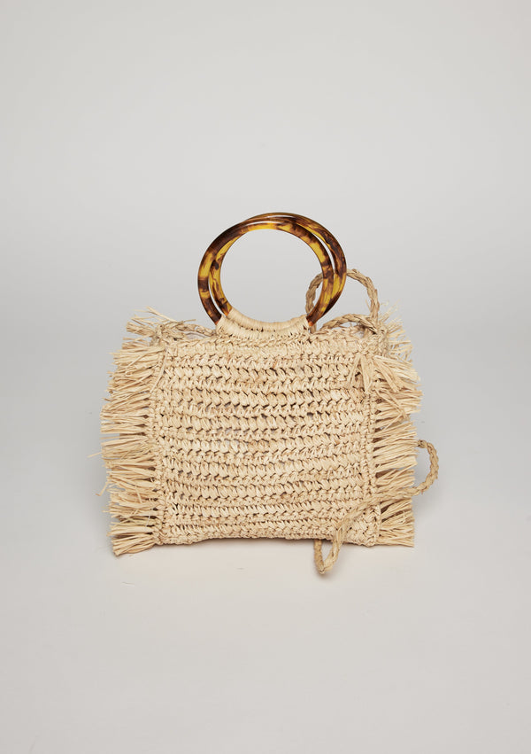 Straw bag with fringed detail, tortoise handles and thin crossbody strap