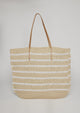 Straw tote with white stripes and leather handles