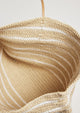 Inside of straw bag with white stripes