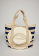 Navy striped straw tote bag with a white sun hat attached