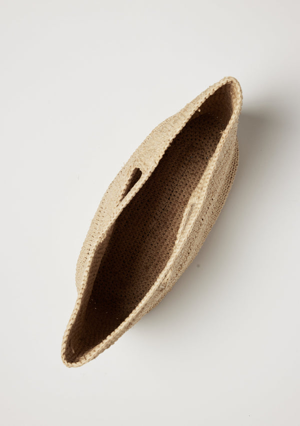 Inside of tan straw bag