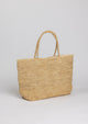 Large straw beach tote on angle