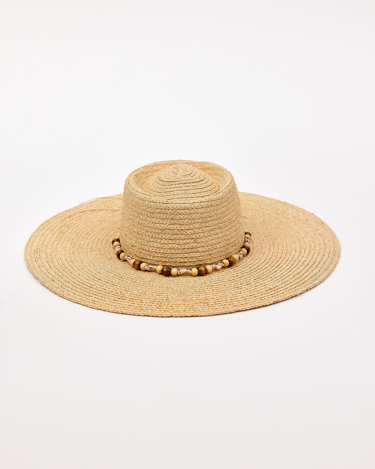 Beige straw hat with a wide brim and decorative beads on a white background