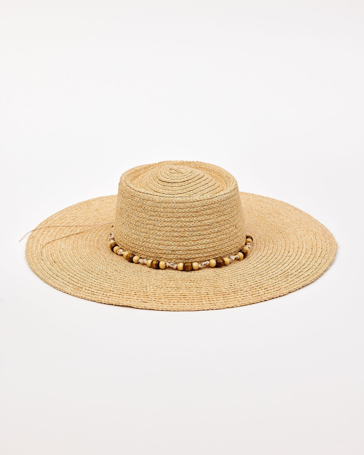 Beige straw hat with a wide brim and beaded trim detail on a white background
