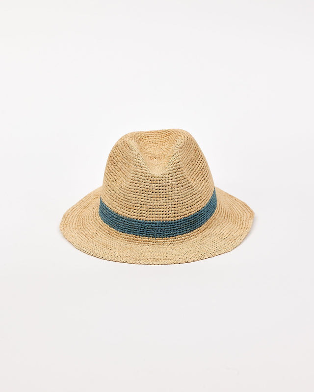 Straw hat with a blue band on a light beige background
