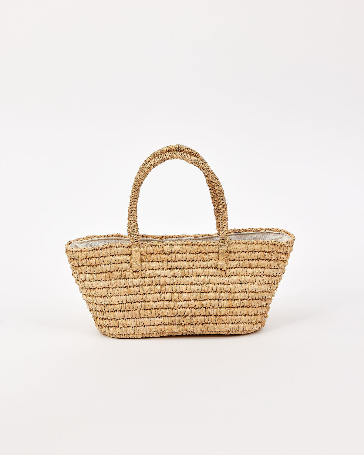 Woven straw bag on a white background