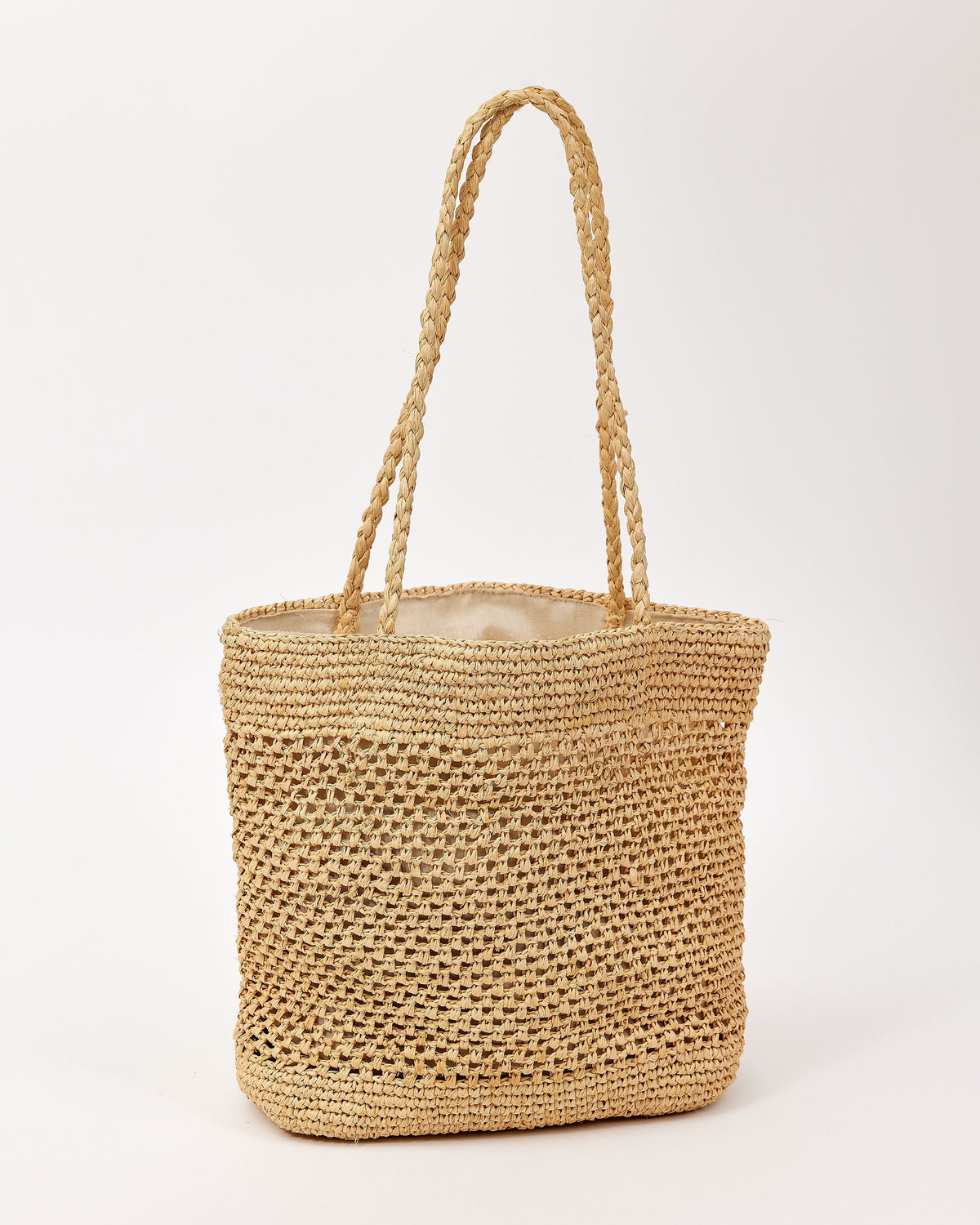 Woven straw bag on a white background