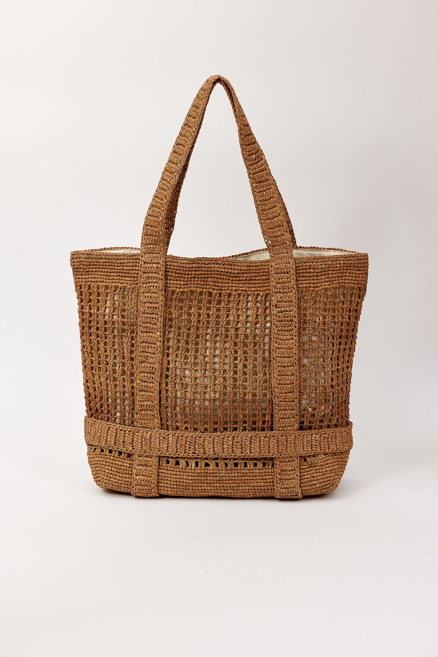 Brown straw bag with straps to hold a hat