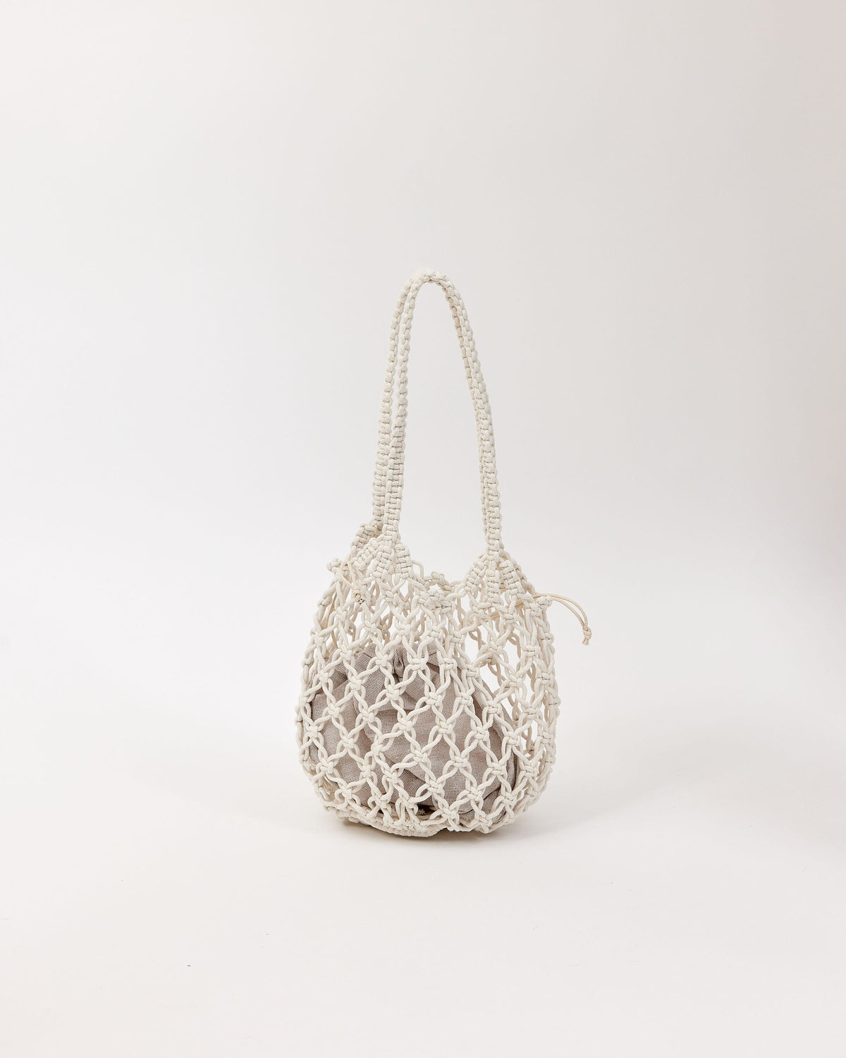 Open weave handbag with a handle on a white background