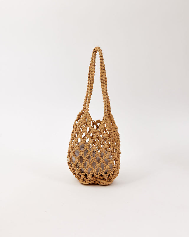 Brown open weave handbag on a white background