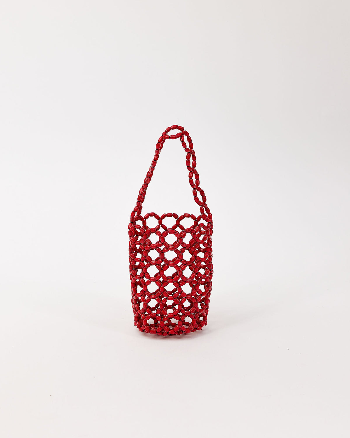 Red beaded handbag on a white background
