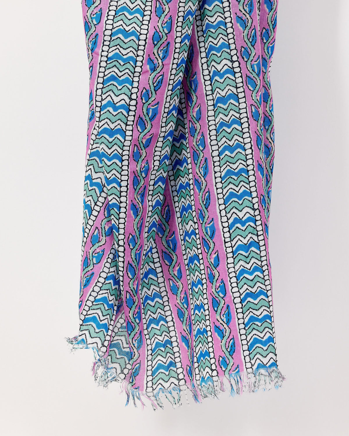 Colorful patterned scarf with blue, pink, and green design on a white background