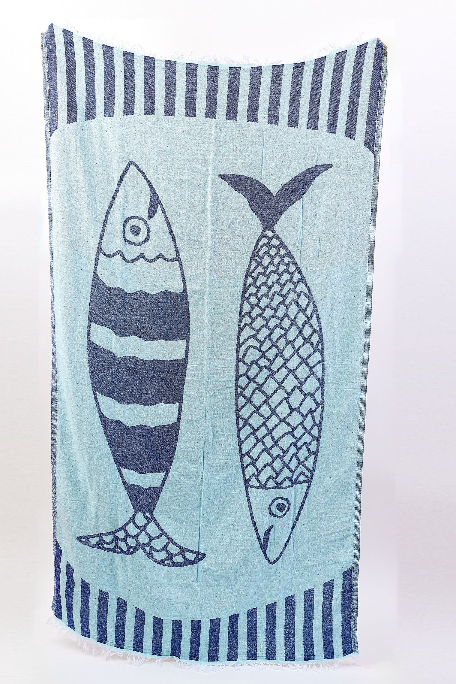 Towel with fish design on a light blue background