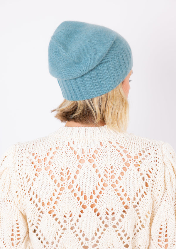 Cashmere Slouchy Cuff beanie in marine blue on model from back