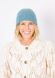 Cashmere Slouchy Cuff beanie in marine blue on model in ivory sweater