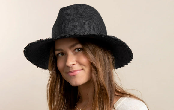 Woman with black staw hat.