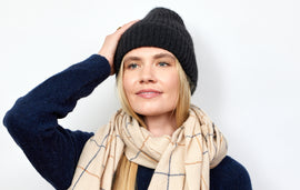 Woman wearing scarf and beanie.