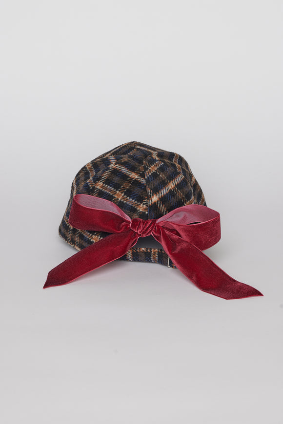 Back of dark plaid cap with red bow