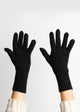Black cashmere gloves on hands