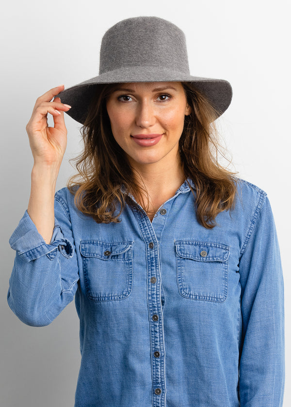 Model wearing light grey velour hat