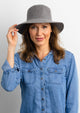 Model wearing grey velour bucket hat
