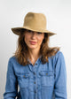 Model wearing camel colored velour hat