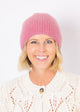 Close up of mauve pink cashmere beanie on model