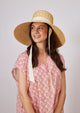 Large brimmed sunhat with ivory ribbon tie on model