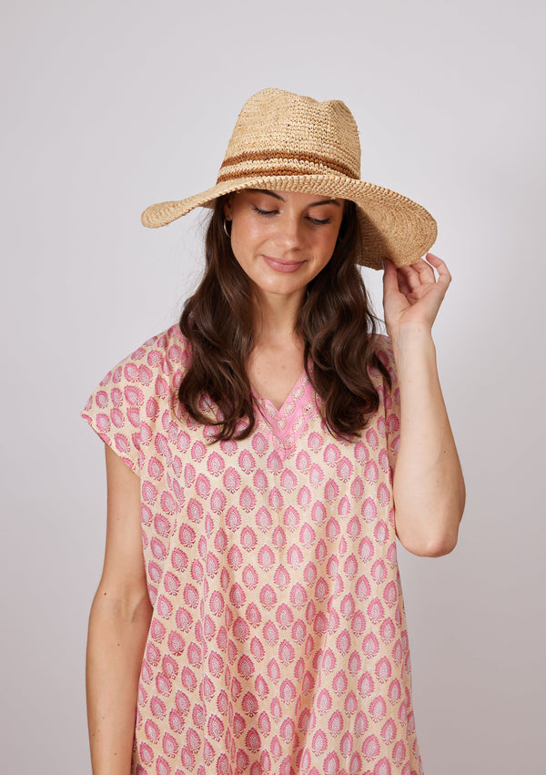 Model wearing sun hat with brown double stripe detail