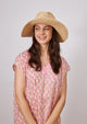 Model wearing sun hat with brim flipped up