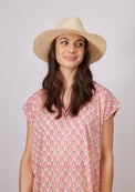 Model looking to her left wearing fringed straw hat