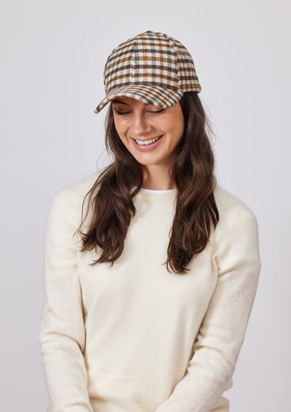 Ivory and brown small plaid baseball cap on model