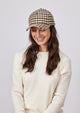 Ivory and brown small plaid baseball cap on model