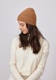 Tobacco brown cashmere slouchy cuff beanie on model in ivory sweater