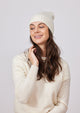 Ivory cashmere slouchy beanie on model in ivory sweater