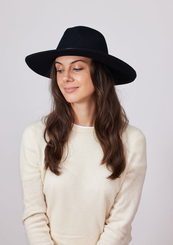 Model wearing black wool felt brimmed hat