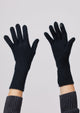 Model wearing black cashmere texting glove