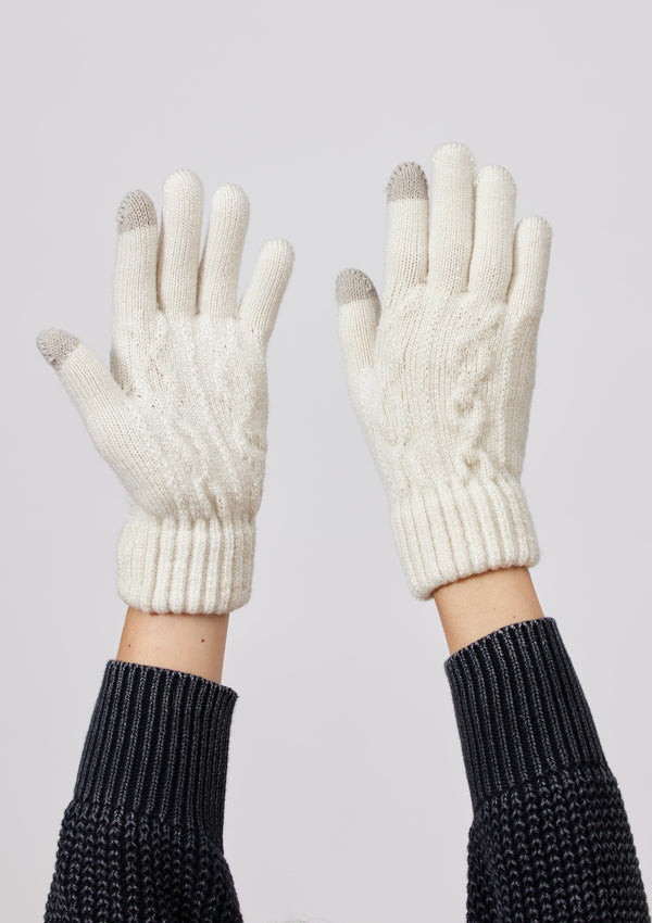 Model wearing ivory knit touch screen gloves