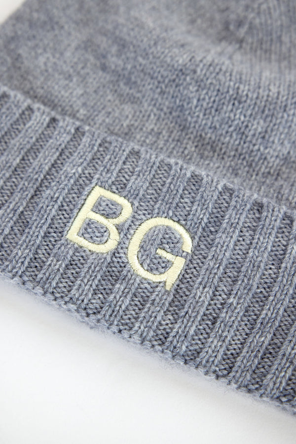 Close up of Grey cashmere beanie with embroidered letters