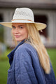 Model wearing a white large brimmed sunhat