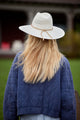 Back of white straw hat on model