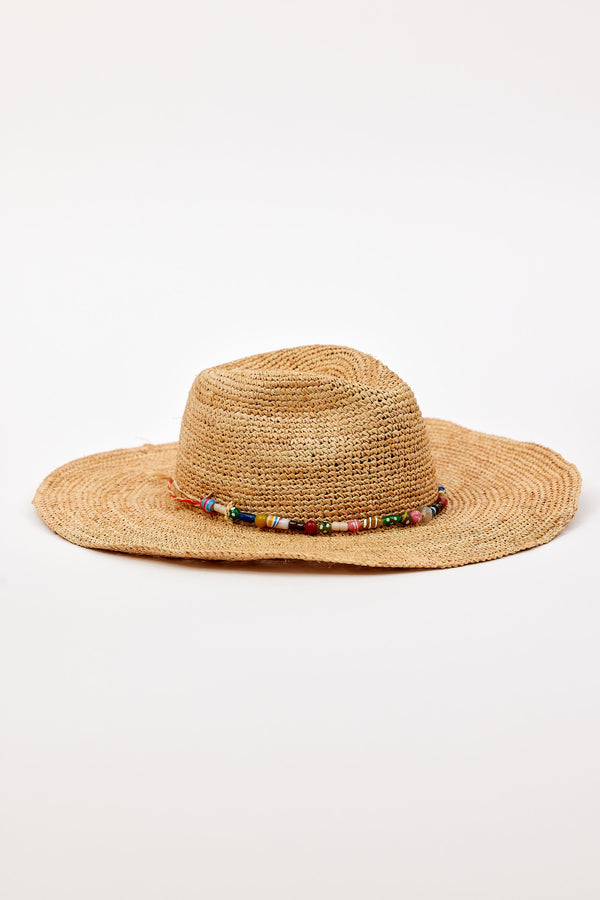 Raffia hat with a beaded band on a white background