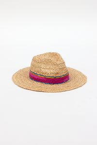 3/4 angle of braided raffia sunhat with pink, yellow and blue trim