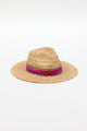 3/4 angle of braided raffia sunhat with pink, yellow and blue trim