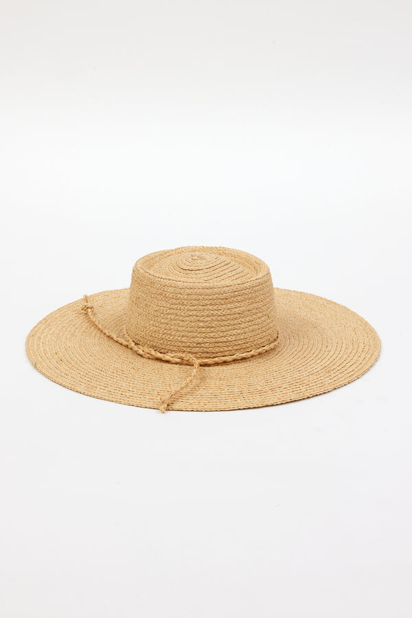 3/4 angle of brimmed straw sun hat with straw trim