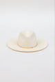 Front angle of white brimmed hat with gold trim and slightly lifted brim