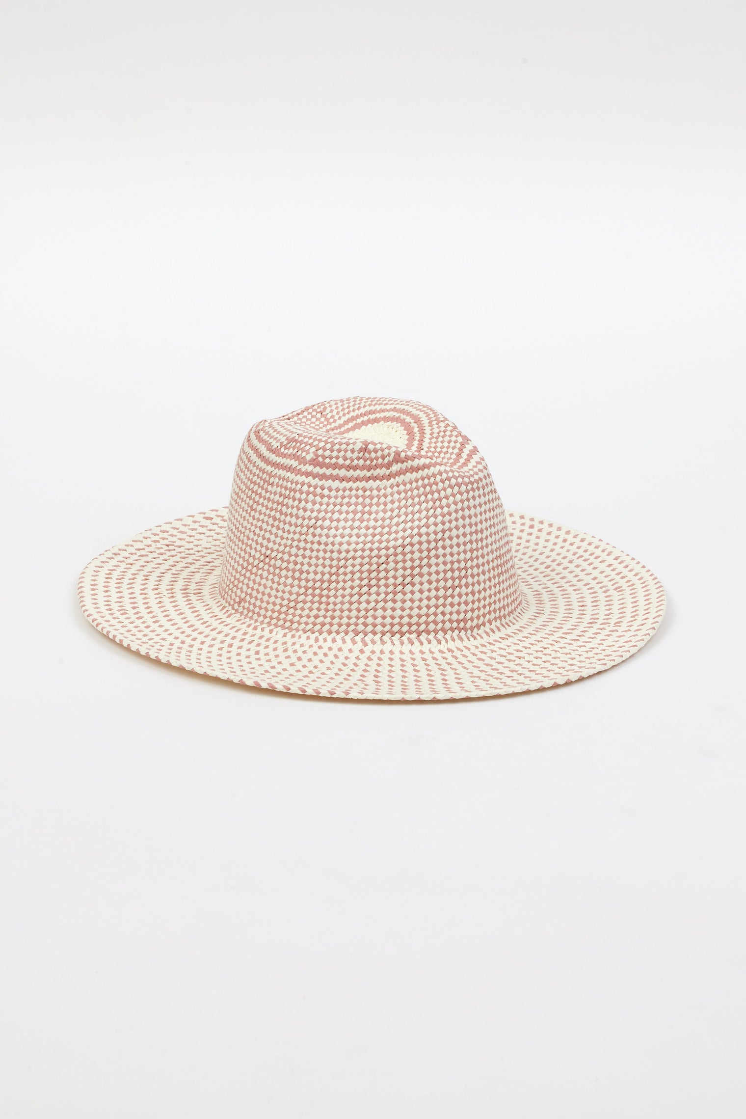 3/4 angle of pink and natural colored brimmed straw sun hat