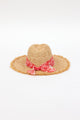 back of braided raffia sunhat with coral floral trim